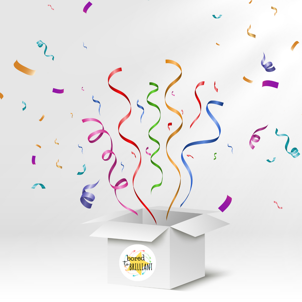 box with bored to brilliant logo exploding in a fun celebration with confetti and streamers coming out of box