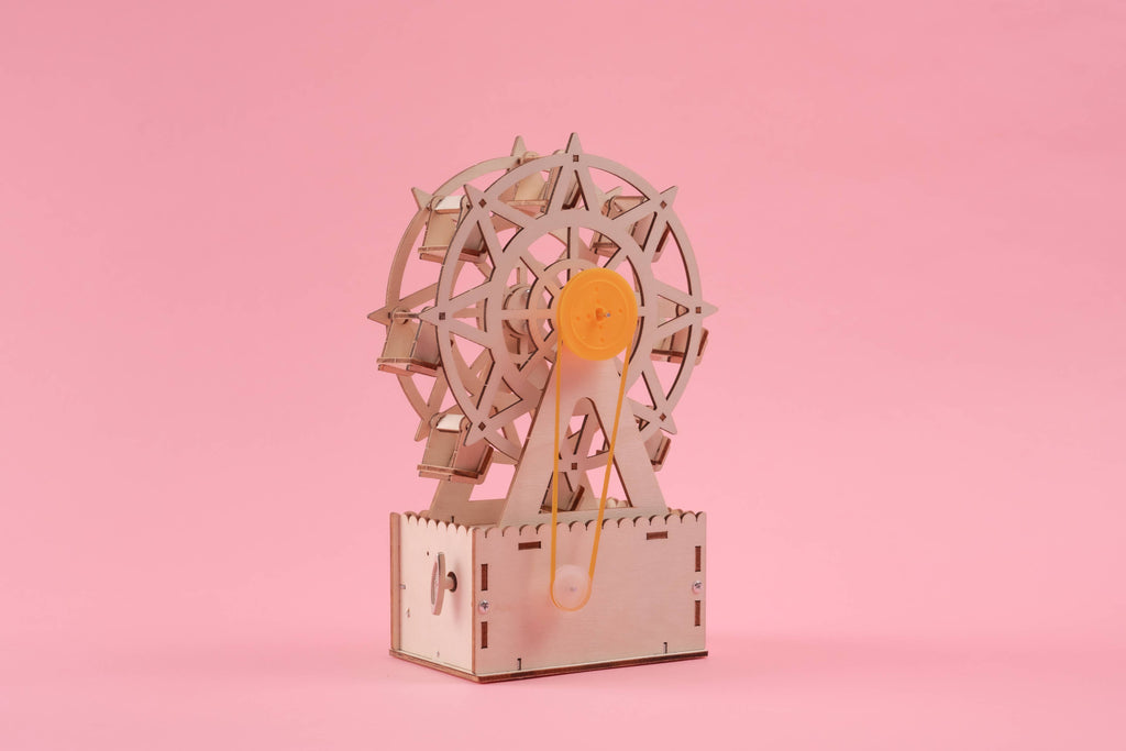 Music Box Ferris Wheel DIY Kit, Fun STEM Toy for Kids completely built showing on a pink backdrop love this for older kids