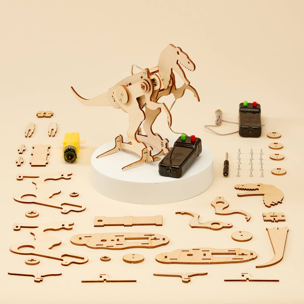 T-Rex Robot DIY Kit, STEM kids toy on yellow backdrop, all parts depicted